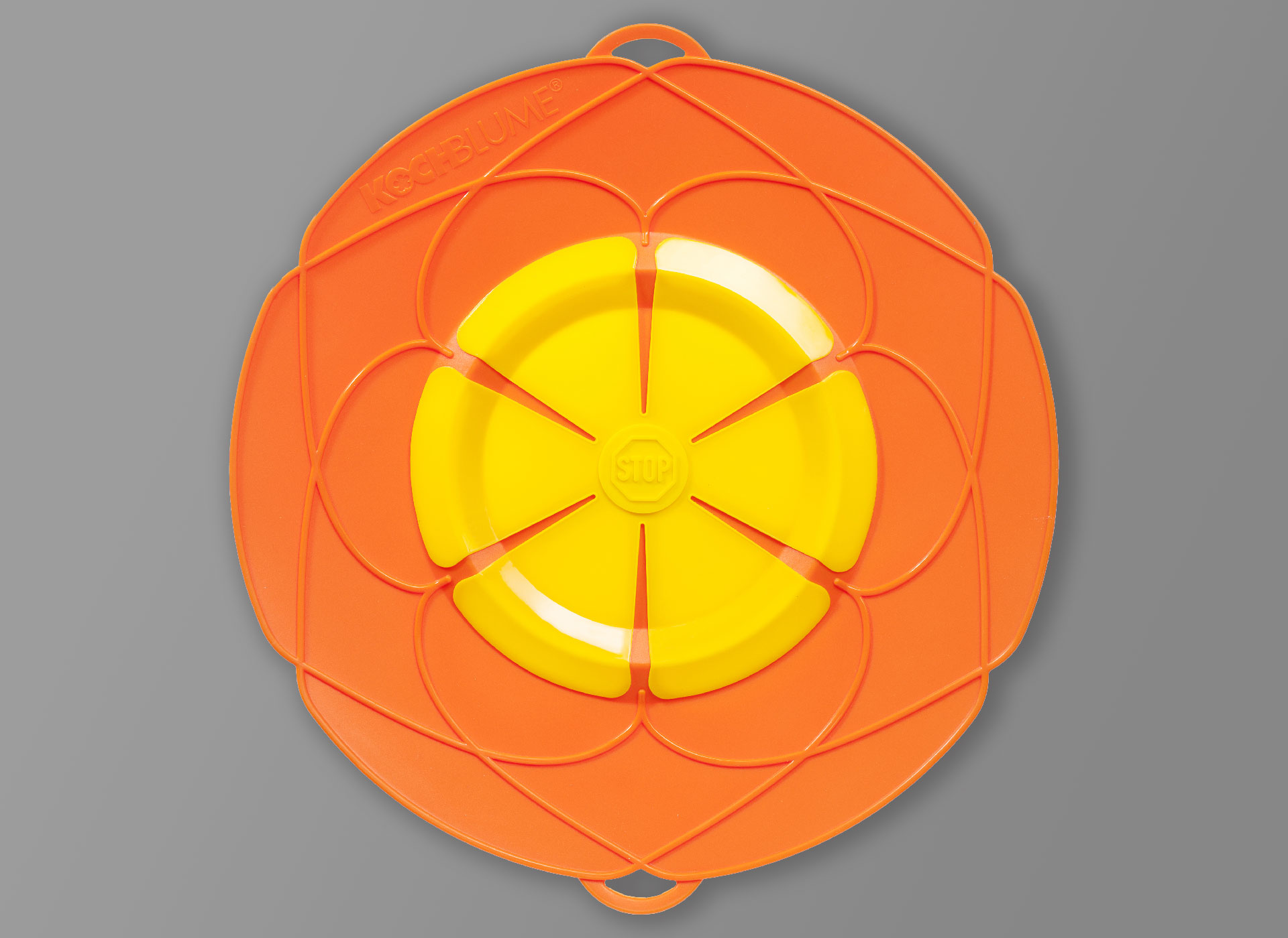 Ansicht auf die orange-gelbe Plastikplatte, wie eine Blüte.